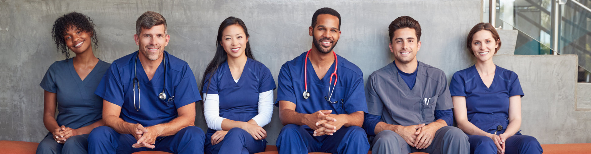 nurse aides sitting down side by side