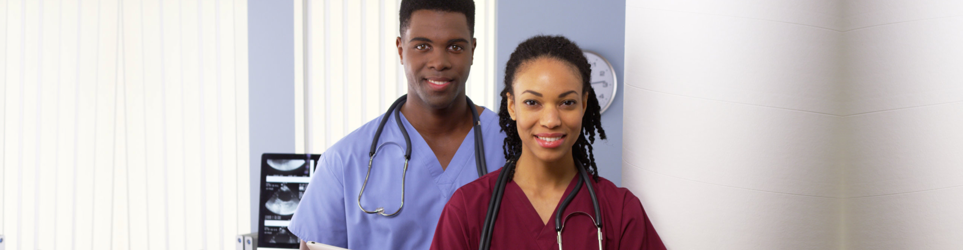 male and female nurses standing side by side